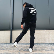 Load image into Gallery viewer, &#39;CREATIVE MINDS ART CLUB&#39; HOODIE BLACK
